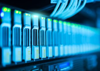 Detailed image of a server rack with glowing lights in a modern data center.