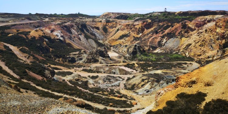 Vibrant aerial view of Parys Mountain's historic copper mine in Wales showcasing rugged geological formations.