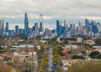 A view of Melbourne's skyline as seen from Hawthorn, showcasing prominent skyscrapers and urban landscape.