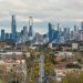 A view of Melbourne's skyline as seen from Hawthorn, showcasing prominent skyscrapers and urban landscape.