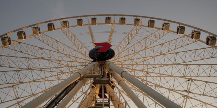 View of the Brisbane Ferris Wheel at sunset, capturing its architectural elegance.