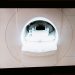Close-up of an MRI scanner displayed on a monitor in a medical clinic.