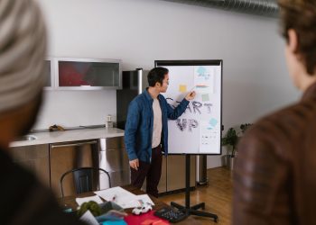 Team members discussing project ideas in a modern office setting.