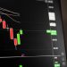 Candlestick chart showing a downward trend in the stock market analysis.