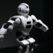 Close-up of a futuristic humanoid robot under dramatic lighting in dark ambiance.