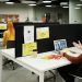 Colleagues working and collaborating virtually at a stylish modern office workspace.