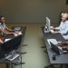 Diverse call center team collaborating in a modern office setting.