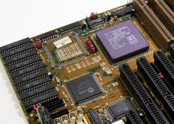Detailed close-up image of a vintage motherboard showcasing microprocessor and components.