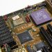 Detailed close-up image of a vintage motherboard showcasing microprocessor and components.