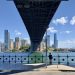 Under the Sydney Harbour Bridge, skyline of Sydney CBD, 2023.jpg