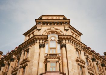 Ornate bank facade in Moscow featuring columns, windows, and architectural details.