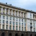 Illuminated government building in Sofia, showing classic architectural design under a twilight sky.