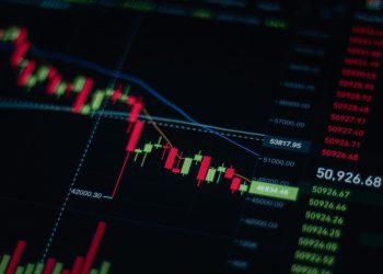 Close-up of stock market chart showing trends and data on a digital screen.