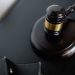 From above of wooden gavel on round surface near folders on table in courtroom