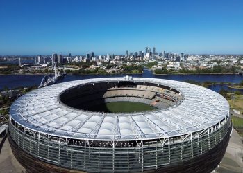 Stunning aerial view of Optus Stadium in Perth, Western Australia with city skyline backdrop.