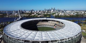 Stunning aerial view of Optus Stadium in Perth, Western Australia with city skyline backdrop.