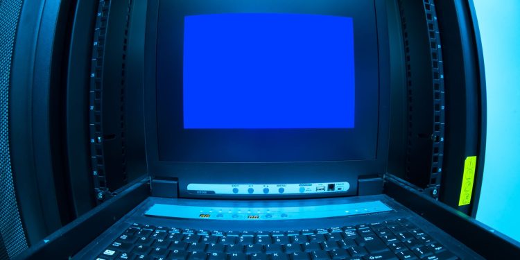 Close-up of a blue screen error shown on a data center control terminal.