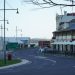 A scenic street in Strahan, Tasmania, showcasing historic buildings and modern architecture.