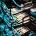 Numerous wires and cables mounted into server patch panel in modern data center