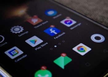 Detailed view of a smartphone screen with popular app icons including Facebook and Messenger.