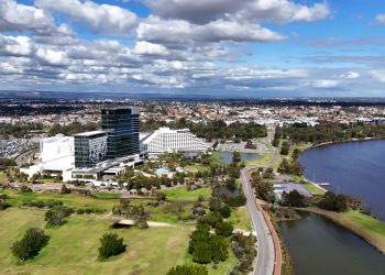 Aerial view capturing Burswood in WA, Australia featuring urban landscape and the scenic Swan River.