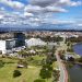 Aerial view capturing Burswood in WA, Australia featuring urban landscape and the scenic Swan River.