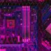 Close-up of a colorful motherboard showcasing intricate circuitry and glowing neon elements.