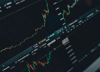 Close-up of stock market trading screen displaying financial growth and charts.