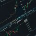 Close-up of stock market trading screen displaying financial growth and charts.