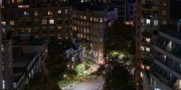 Captured Griffiths Teas Building and city lights illuminating a quiet night in downtown Sydney, Australia.