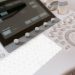 Detailed view of a medical ultrasound machine control panel with buttons and screen.
