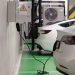 Electric vehicles charging at an indoor station in a modern underground garage.