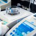 Close-up of laboratory equipment with capsules, capturing pharmaceutical analysis.