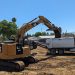 Caterpillar 325 FL excavator on a job site.jpg