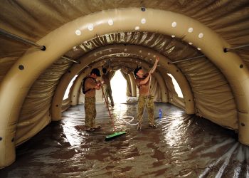 Australian Medical Task Force personnel conduct an initial clean of the inflatable medical Health Facility in Camp Cockatoo. Pakistan 2010. Photo Australian Defence (10674660385).jpg