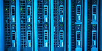 Detailed image of illuminated server racks showcasing modern technology infrastructure.