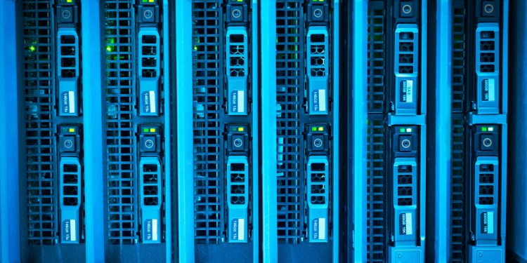 Detailed image of illuminated server racks showcasing modern technology infrastructure.