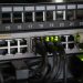 Networking equipment with connected cables, showcasing modern technology infrastructure.