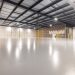 Empty modern warehouse interior with polished floor and ample space located in Texas.