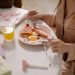 A person enjoys a breakfast of egg, toast, and orange juice. Perfect start to the day.
